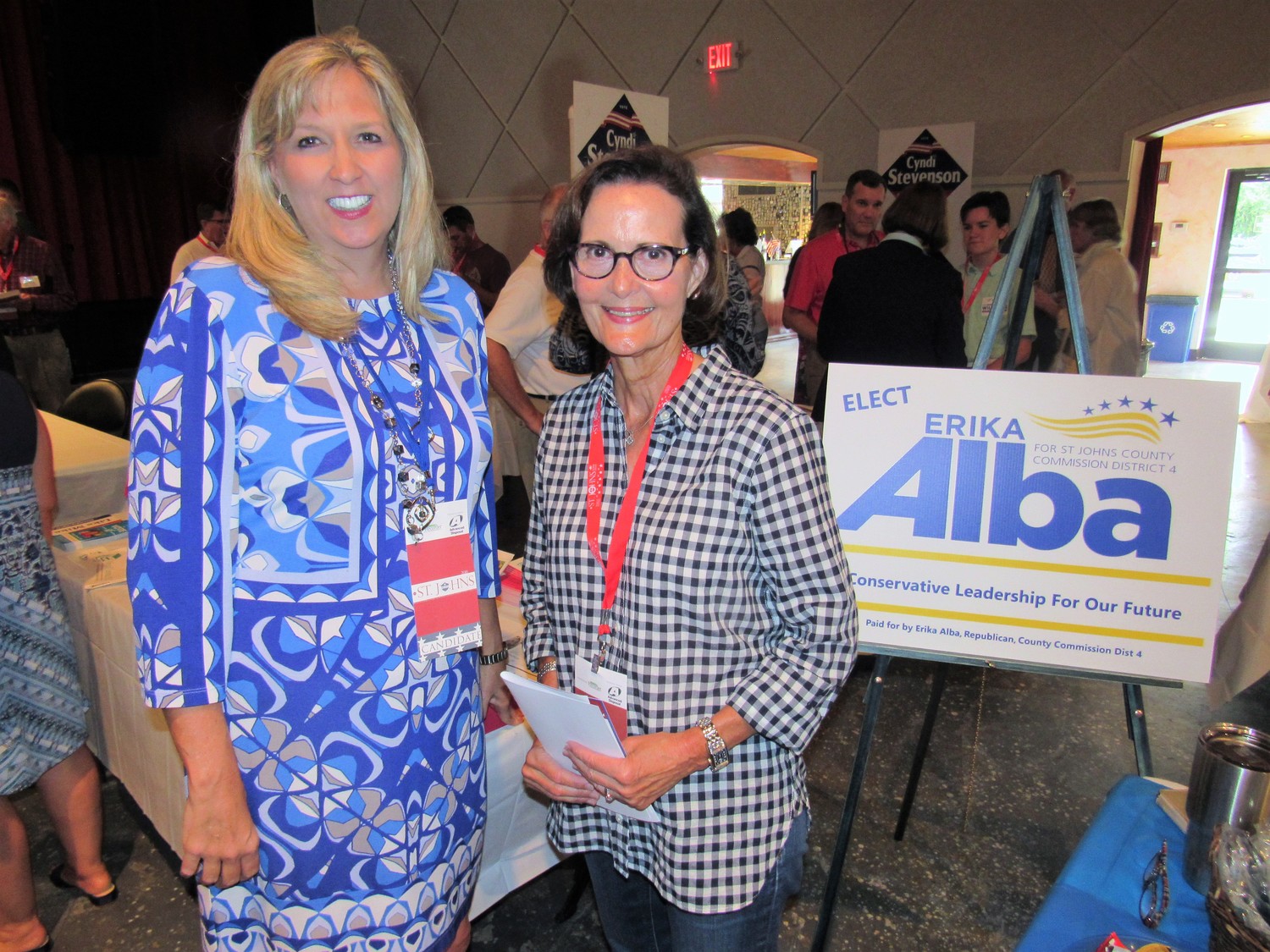 District 4 County Commission candidate Erika Alba poses with Jayne Evans at her table.